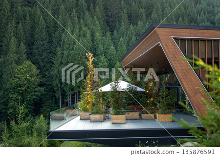 Modern wooden house in the mountains. Terrace with panoramic view 135876591