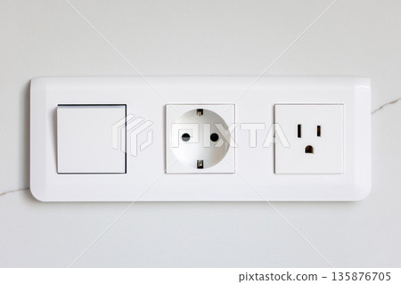 Switch and sockets. White module. Modern wall Switch and sockets. White module. Modern wall 135876705