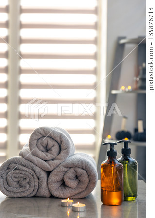 Towels and natural bottles with candles. Home spa feel Towels and natural bottles with candles. Home spa feel 135876713