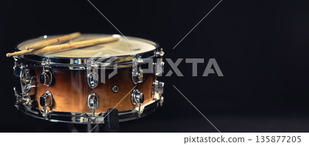 Drum close-up. Drumsticks with a drum. 135877205