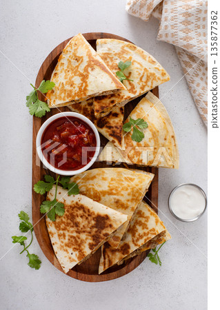 Ground turkey and cheddar quesadillas with salsa 135877362