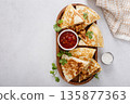 Ground turkey and cheddar quesadillas with salsa 135877363