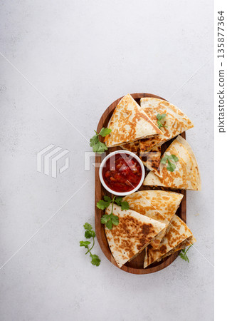 Ground turkey and cheddar quesadillas with salsa 135877364