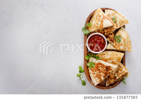 Ground turkey and cheddar quesadillas with salsa 135877365