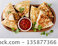 Ground turkey and cheddar quesadillas with salsa 135877366