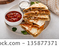 Ground turkey and cheddar quesadillas with salsa 135877371