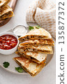 Ground turkey and cheddar quesadillas with salsa 135877372