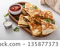 Ground turkey and cheddar quesadillas with salsa 135877373