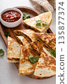 Ground turkey and cheddar quesadillas with salsa 135877374
