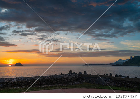 Sunrise Over Keelung Islet at Waimushan Taiwan Summer Dawn. Sunrise Over Keelung Islet at Waimushan Taiwan Summer Dawn. 135877457