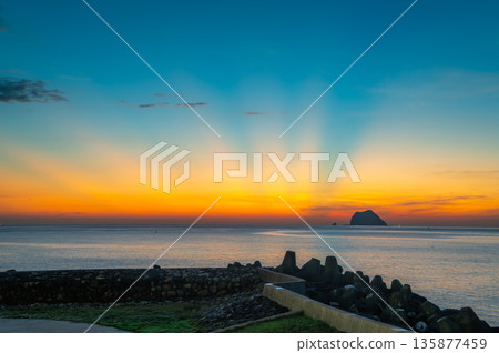 Sunrise over Keelung Islet with Colorful Summer Sky and Calm Sea in Waimushan. 135877459