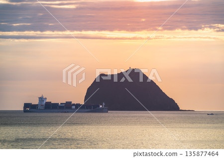 Serene Ship Silhouette at Keelung Waimushan with Keelung Island. Serene Ship Silhouette at Keelung Waimushan with Keelung Island. 135877464