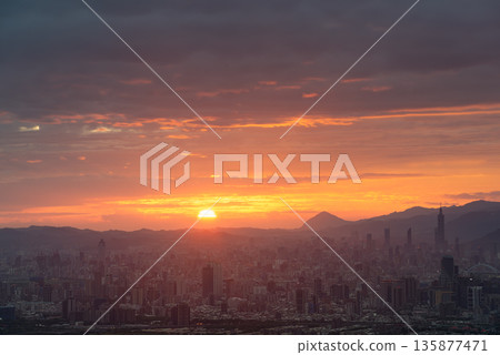 Breathtaking Sunrise Over Taipei City from Dadao Mountain, Shulin, Taiwan. 135877471