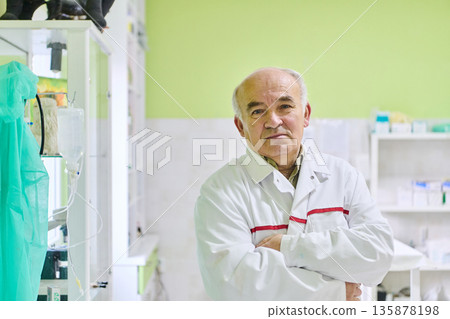 Senior Medical Professional Standing Confidently in Modern Laboratory in White Lab Coat Senior Medical Professional Standing Confidently in Modern Laboratory in White Lab Coat 135878198
