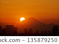 Mount Fuji and the city silhouette in the sunset sky 135879250