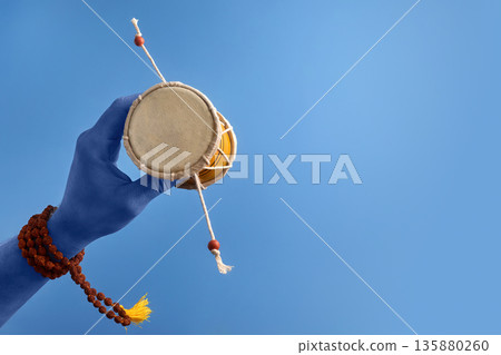 Maha Shivratri. Blue Lord Shiva hand holding damru with rudraksha mala 135880260