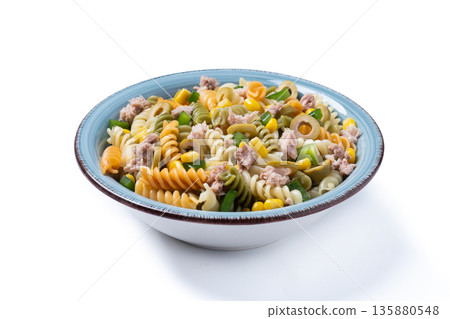 Pasta salad with tuna, corn and olives in bowl isolated on white background 135880548