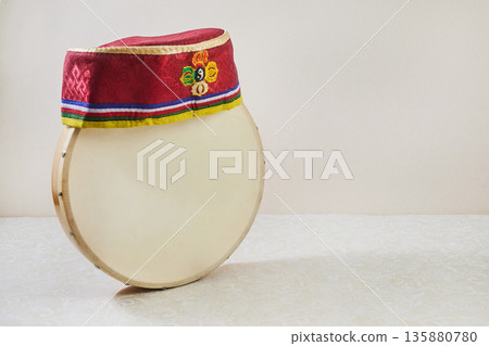 Happy Sonam Losar lunar New Year festival of Nepal. Traditional Tamang topi hat and hand drum. Happy Sonam Losar lunar New Year festival of Nepal. Traditional Tamang topi hat and hand drum. 135880780