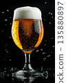 A glass of cold light foamy beer on a black background, close-up with bubbles and splashes, a refreshing drink for advertising a bar, pub, brewery, and party.	 135880897