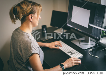 Female works on computer Female works on computer 135881101
