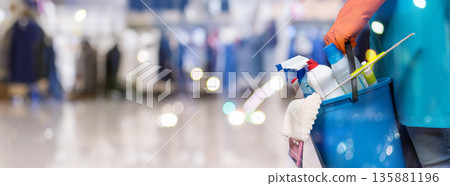 Cleaning in a busy store. 135881196