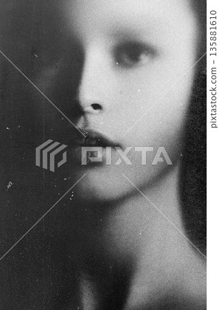 Young woman's face fading into soft focus monochrome Young woman's face fading into soft focus monochrome 135881610