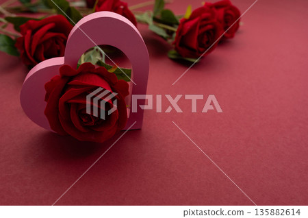 Pink Heart Shapes on Red Background with Copy Space Valentines Day Love Concept Pink Heart Shapes on Red Background with Copy Space Valentines Day Love Concept 135882614