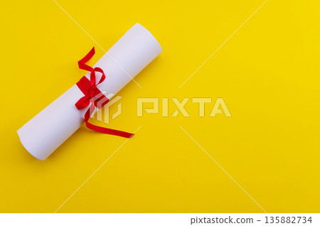 A symbolic representation of global education, graduation. graduation cap, books, globe and diploma on a colorful background. 135882734