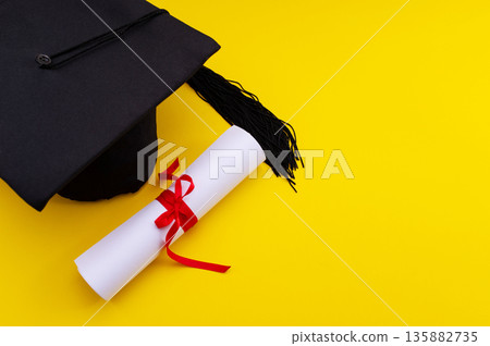 A symbolic representation of global education, graduation. graduation cap, books, globe and diploma on a colorful background. 135882735