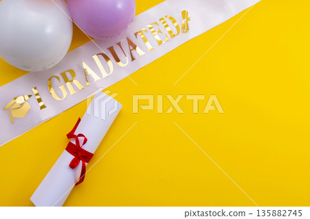 A symbolic representation of global education, graduation. graduation cap, books, globe and diploma on a colorful background. A symbolic representation of global education, graduation. graduation cap, books, globe and diploma on a colorful background. 135882745