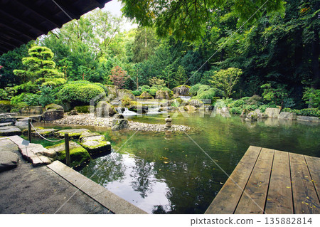 Japanese Garden in Augsburg: pond, pavilion, cascade of waterfall 135882814