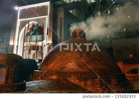 steam from sulphur bathes (bathhouse) with sulphur smell 135882933