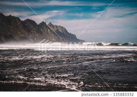 Playa del Roque de las Bodegas beach on Tenerife with ocean waves and cliffs 135883332