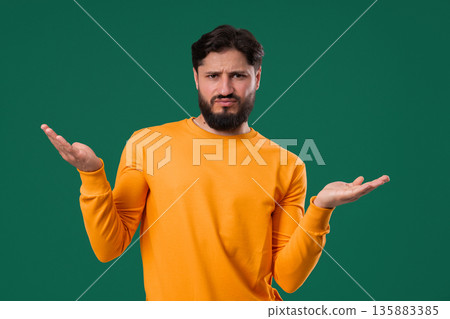 Mature man shrugs shoulders showing uncertainty, confusion, dilemma, hesitation 135883385