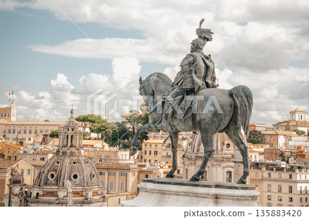 Vittorio Emanuele Equestrian statue Overlooking Historic Skyline on Bright Day Vittorio Emanuele Equestrian statue Overlooking Historic Skyline on Bright Day 135883420