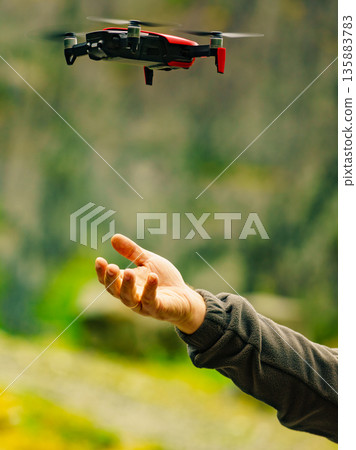 Start the drone, launching from hand Start the drone, launching from hand 135883783