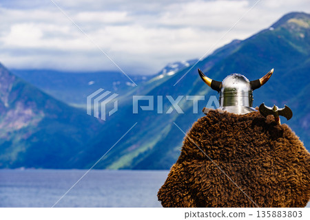 Viking warrior on fjord shore, Norway 135883803