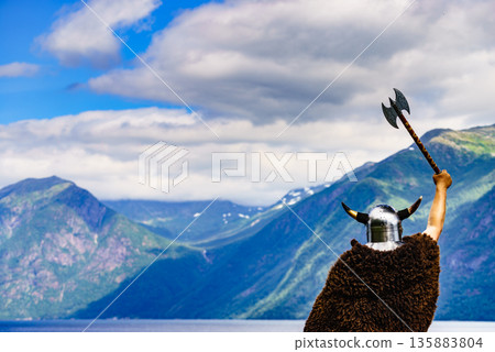 Viking warrior on fjord shore, Norway 135883804