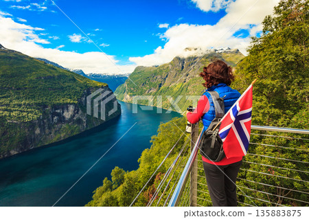 Tourist taking photo of fjord landscape, Norway 135883875