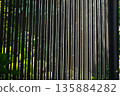 Seamless pattern of modern wall paneling with vertical wooden slats 135884282