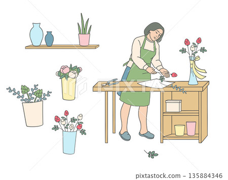 Female florist arranging flowers at work table. Flower arrangement process, handmade floristry, small business concept. Female florist arranging flowers at work table. Flower arrangement process, handmade floristry, small business concept. 135884346