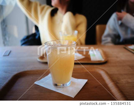 A woman relaxing at a cafe A woman relaxing at a cafe 135884531