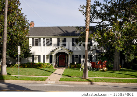 Classic residential house with front lawn in quiet suburban neighborhood Classic residential house with front lawn in quiet suburban neighborhood 135884801