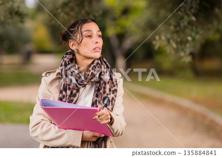 Volunteer collecting signatures working on street 135884841