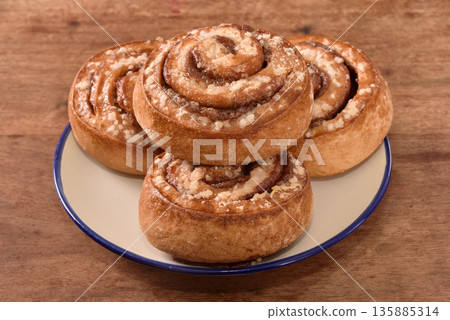 Freshly baked cinnamon roll Freshly baked cinnamon roll 135885314
