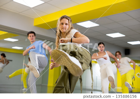 Teen girl in wide pants dancing hip hop 135886156