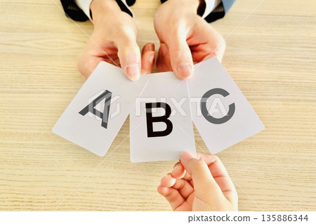 Person choosing from choice cards Person choosing from choice cards 135886344