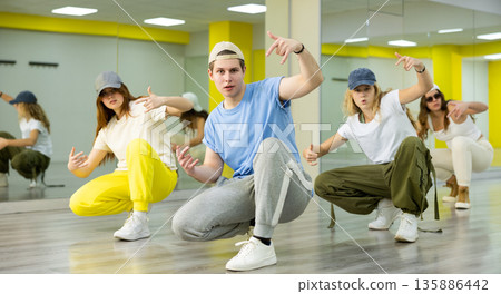 Group portrait of lucky teenagers in dance studio Group portrait of lucky teenagers in dance studio 135886442