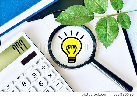 Magnifying glass, light bulb and book Magnifying glass, light bulb and book 135886586