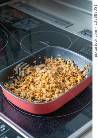 Minced meat dish being cooked in a frying pan Minced meat dish being cooked in a frying pan 135888051